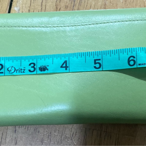 Coach wallet 7.5” wide 4” tall it only has a small black ink you can see it - Picture 6 of 7